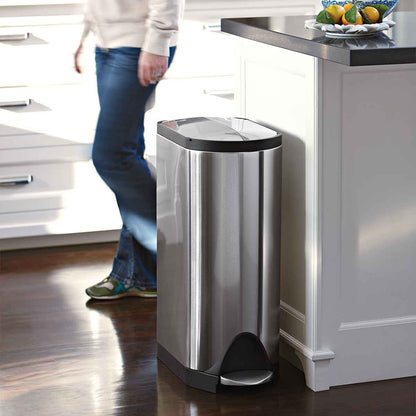 Simplehuman 30L Butterfly Step Can, Brushed Stainless Steel, fitting slimly beside a kitchen counter, hands-free pedal.
