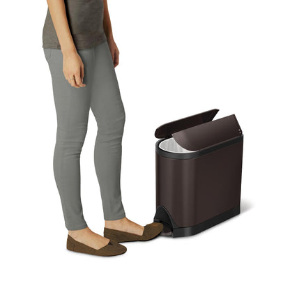 Action view of Simplehuman Dark Bronze 10L Butterfly Step Can, hands-free pedal opens split lid.