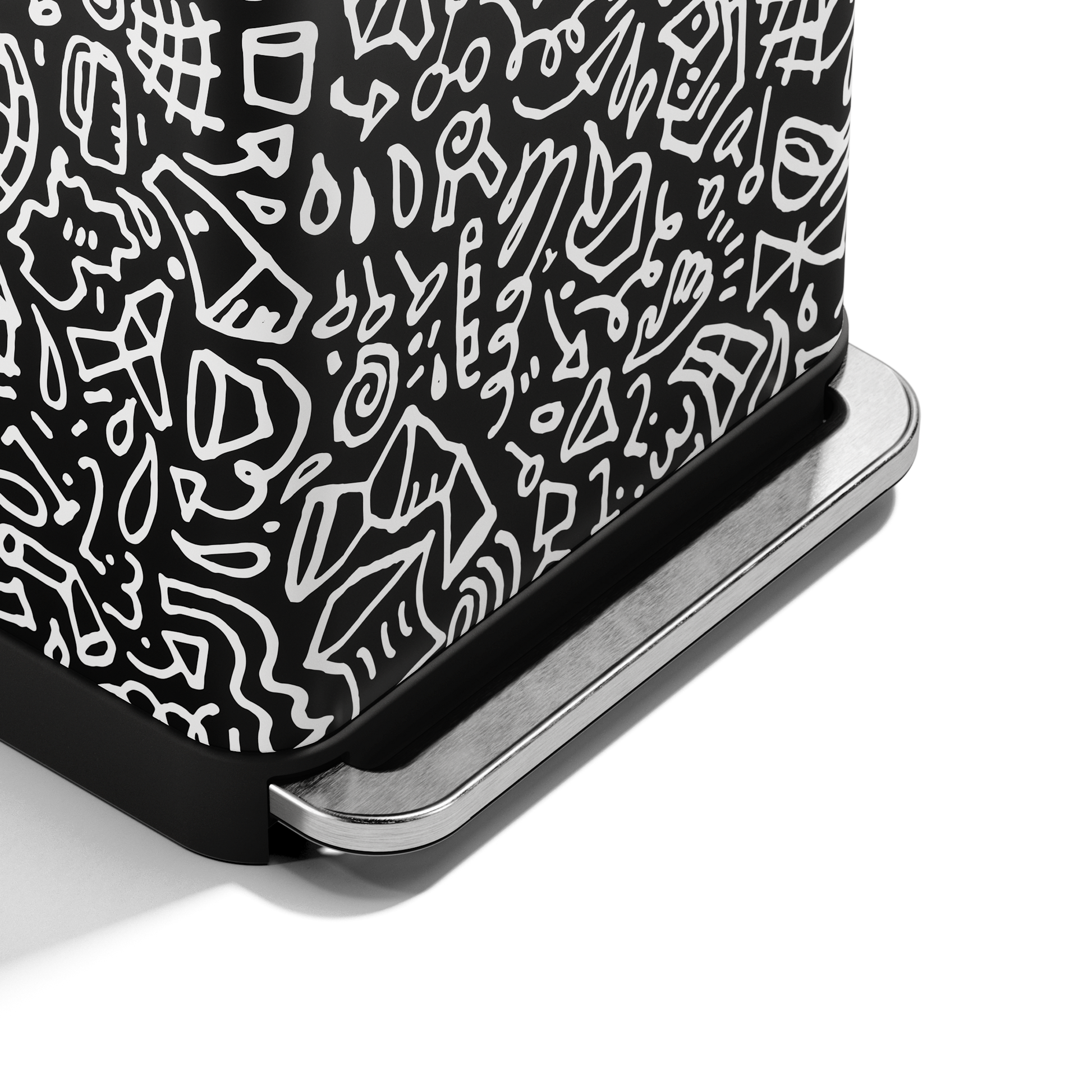 Close-up of Simplehuman 55L Rectangular Step Can black graphic print and durable hands-free pedal.