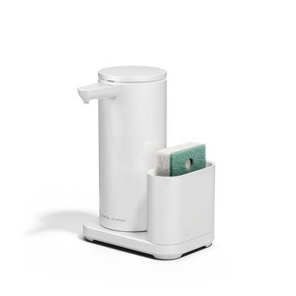 Angled view: Simplehuman White 14 oz Sensor Pump + Caddy, touch-free rechargeable dispenser holding a sponge.