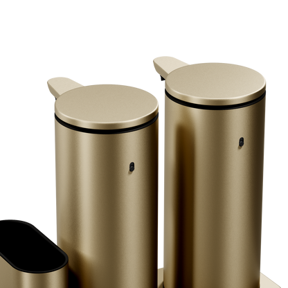 Close-up showing the cylindrical bodies of the Simplehuman Brushed Brass Dual Sensor Pump 14 oz., rechargeable, hands-free.