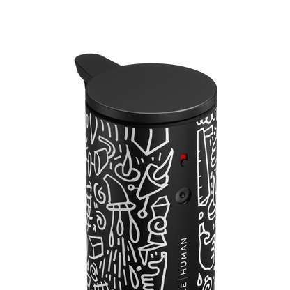 Close-up detail of Simplehuman 9 oz. Sensor Pump in Black Doodle Graphic, showing power switch and adjustable dosage dial.