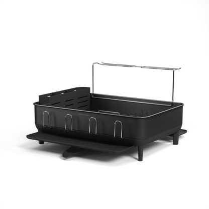Simplehuman Matte Black Steel Frame Dishrack, angled view showing utensil caddy with knife block and pivoting drain spout.