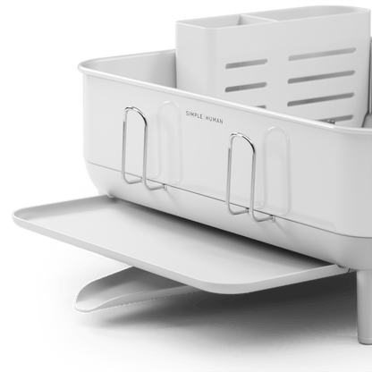 Detail view of Simplehuman Compact Steel Frame Dishrack, White, showing side extension tray and exterior cup holders.