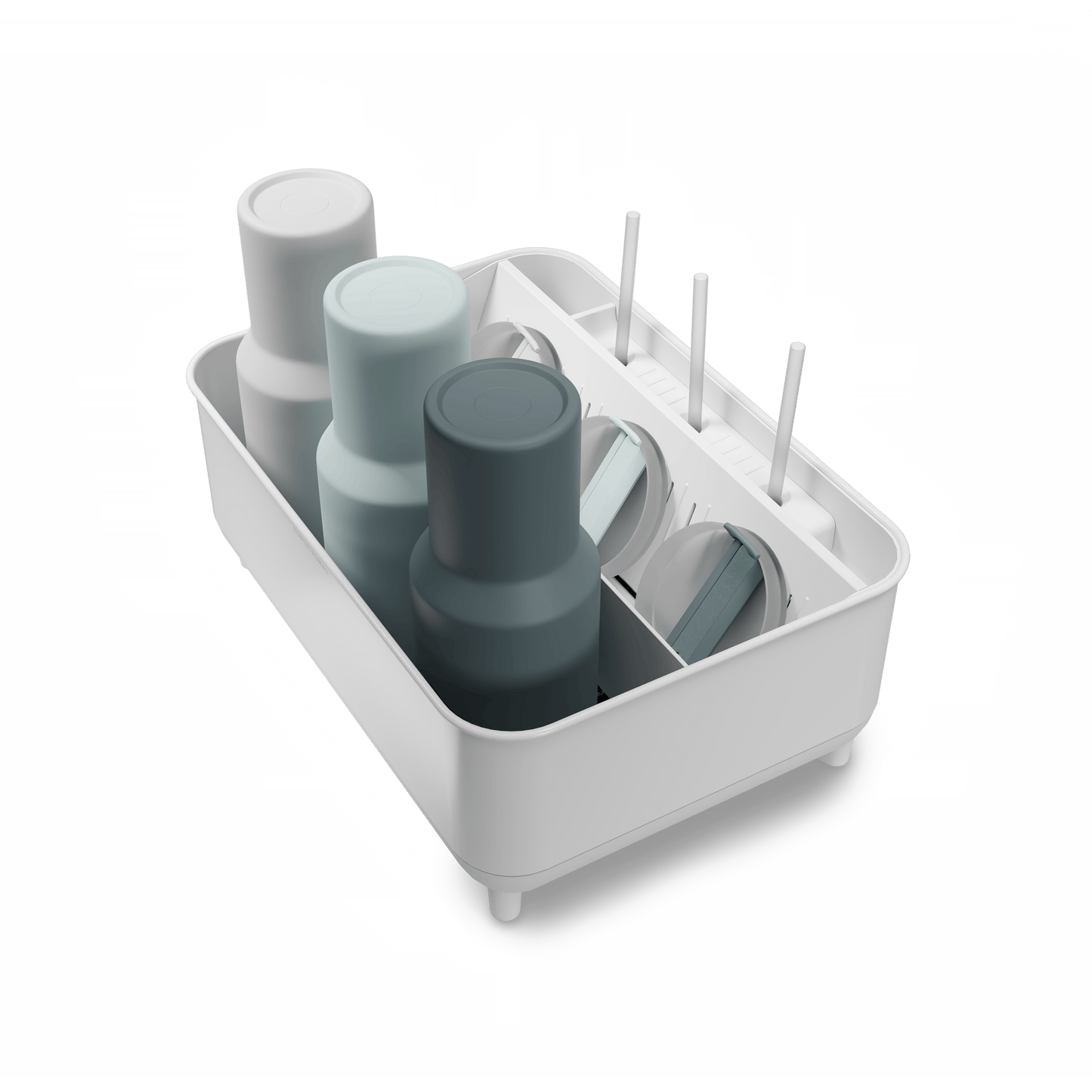 Angled view of Simplehuman White Bottle Dock holding 3 reusable bottles in assorted colors with straws and lids.
