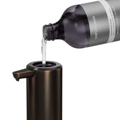 Simplehuman's Refill Bottle filling a Simplehuman Liquid Sensor Pump.